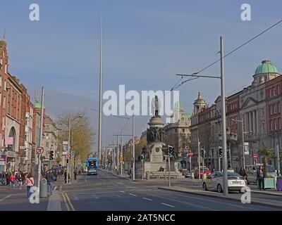 Bronze statue of political leader and catholic emancipator Daniel O`Connel by sculptor John Henry Foley and modern Dublin Spire Stock Photo